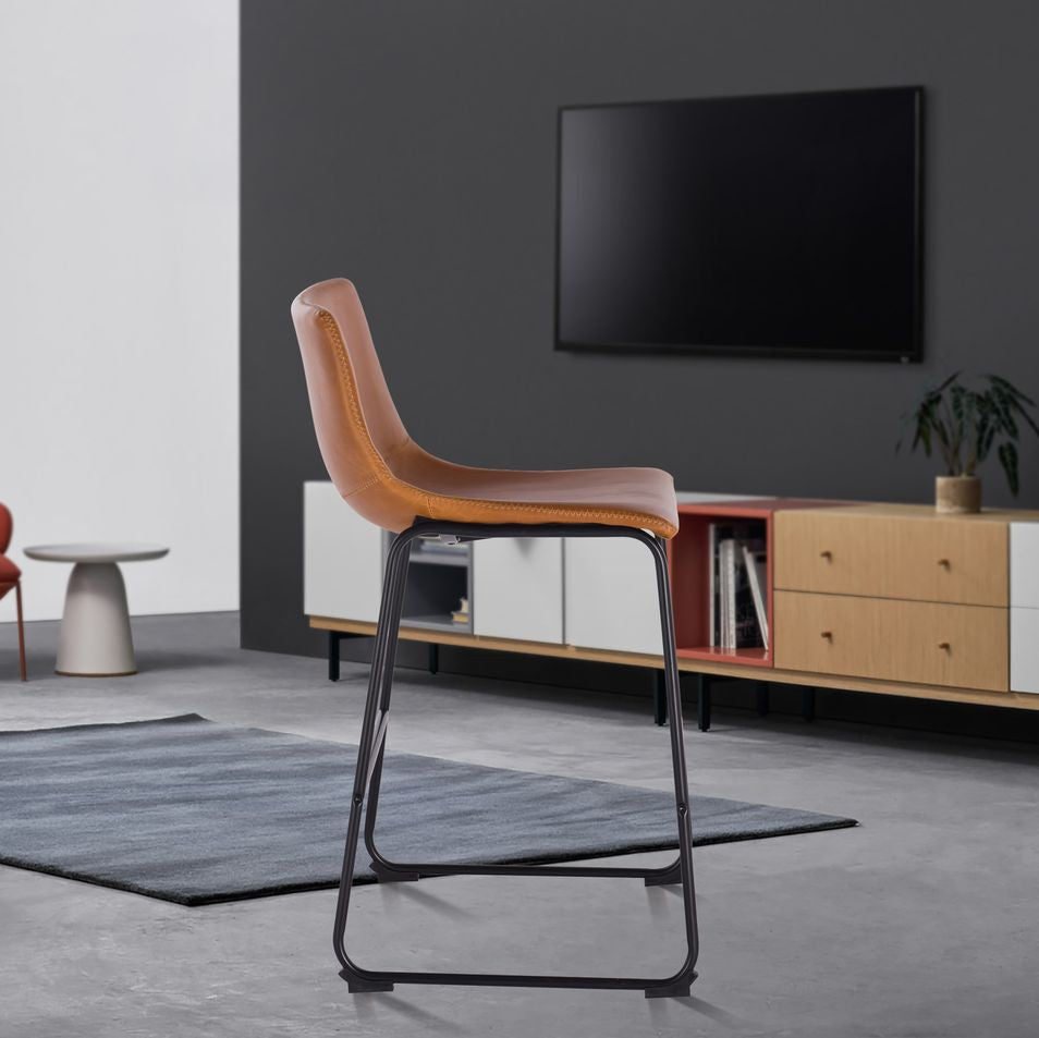 Modern living room with a tan counter stool and wooden entertainment unit.