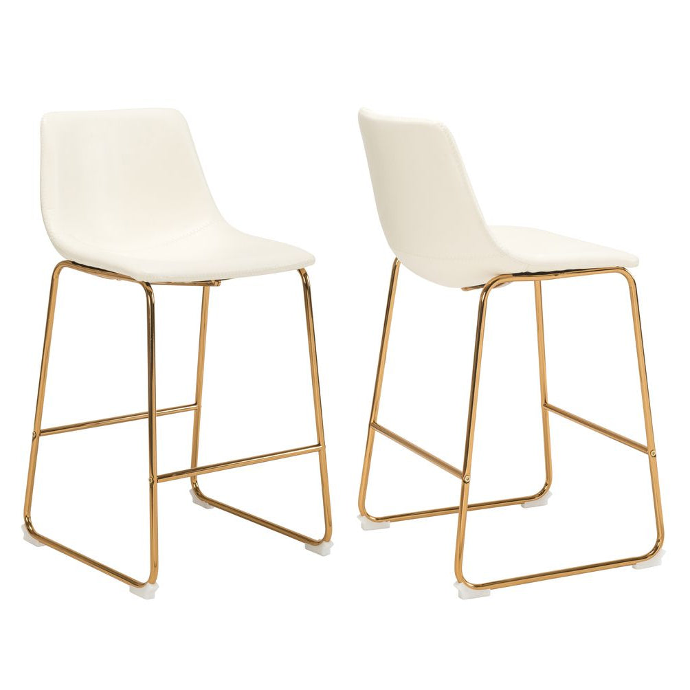 Two white counter stools with gold metal legs on a white background
